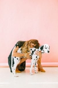 A woman hugging her dog.